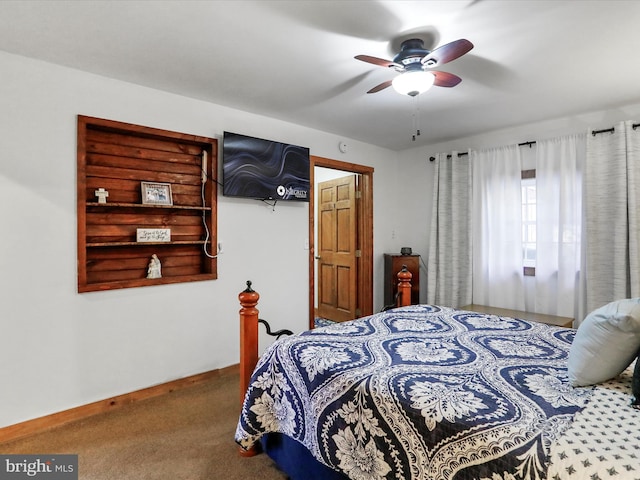 carpeted bedroom featuring ceiling fan and baseboards