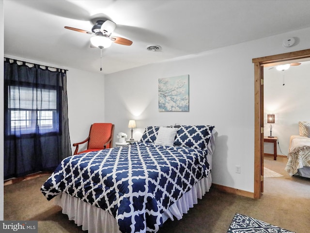 bedroom featuring baseboards, visible vents, and carpet flooring