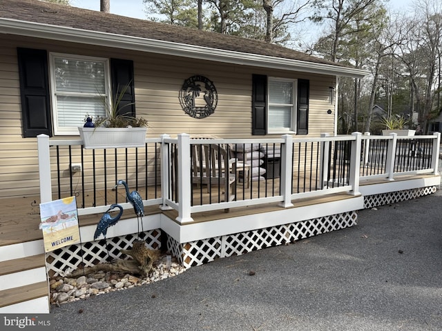 property entrance with a wooden deck