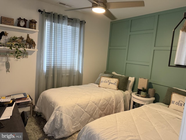 bedroom with a ceiling fan and visible vents