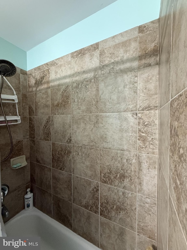 bathroom with shower / bath combination