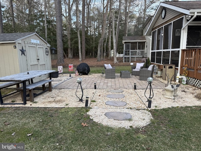 view of yard featuring an outdoor hangout area, a sunroom, a patio area, a shed, and an outdoor structure