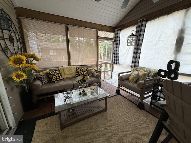 sunroom featuring vaulted ceiling