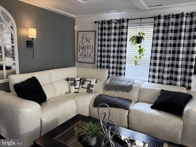 living room with visible vents and ornamental molding