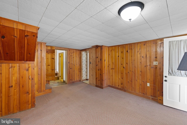 interior space with wooden walls and baseboards