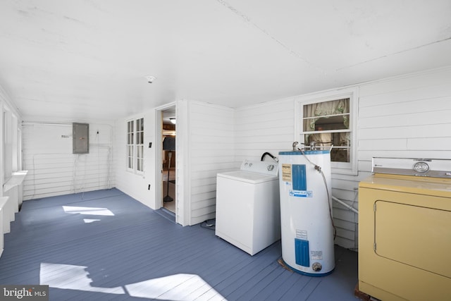 clothes washing area with washer / clothes dryer, water heater, electric panel, and laundry area