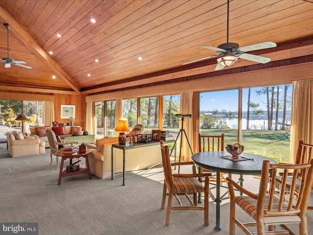 sunroom / solarium with a healthy amount of sunlight, wooden ceiling, lofted ceiling with beams, and ceiling fan