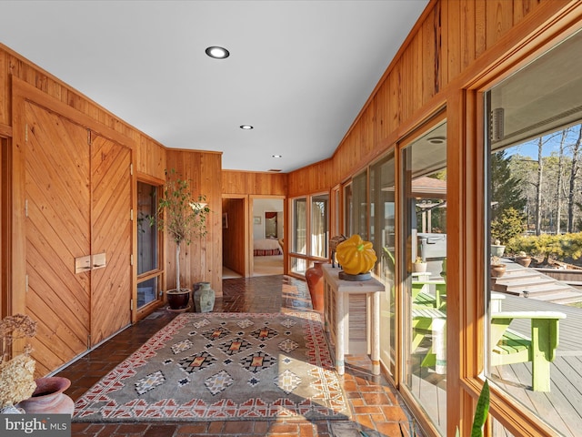 interior space featuring recessed lighting and wooden walls