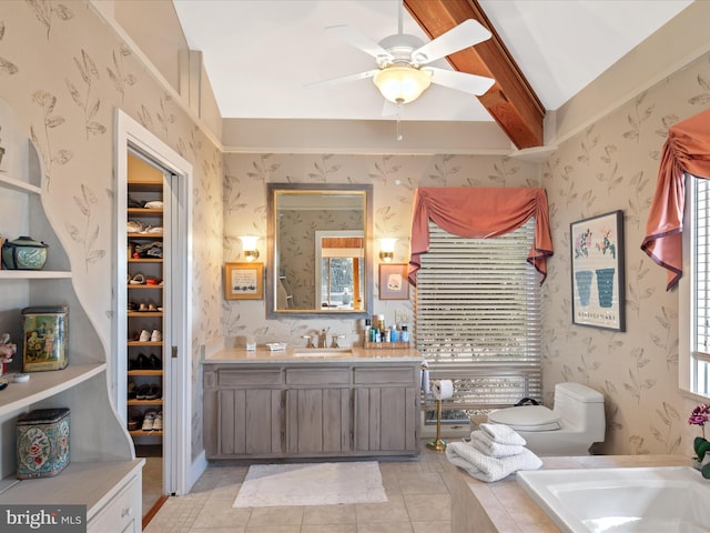 bathroom featuring toilet, ceiling fan, vanity, and wallpapered walls