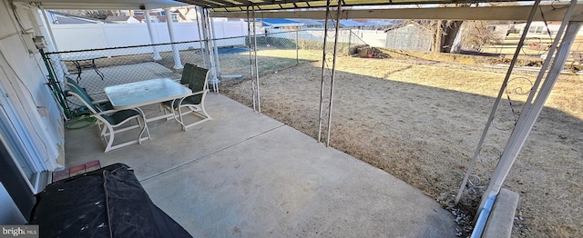 view of patio / terrace featuring fence