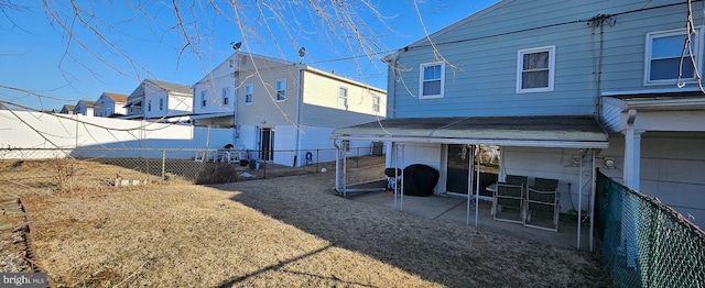 exterior space with a patio area and a fenced backyard