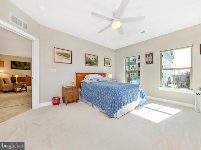 bedroom featuring carpet, visible vents, and baseboards