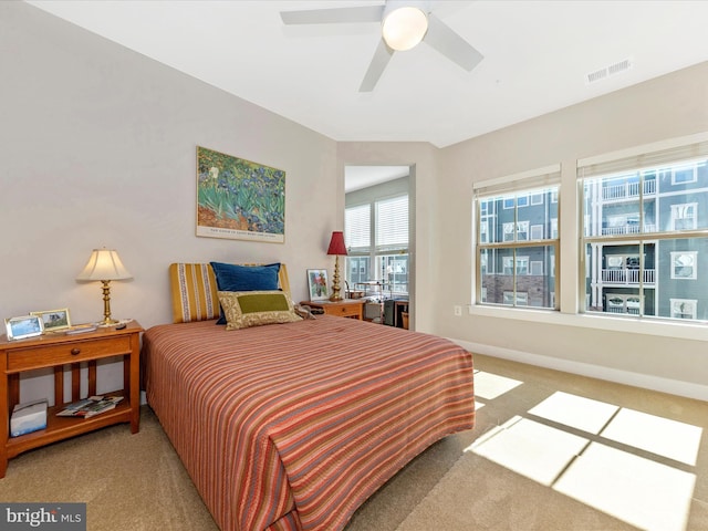 bedroom with carpet, visible vents, and baseboards