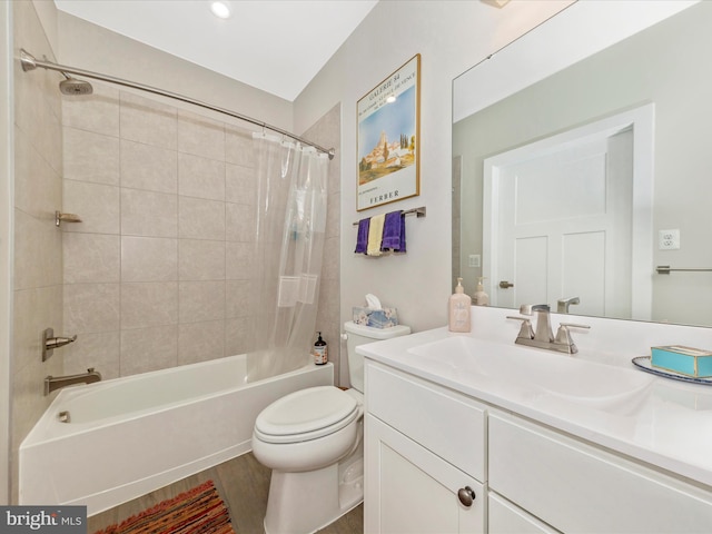 full bath featuring vanity, toilet, wood finished floors, and shower / tub combo with curtain