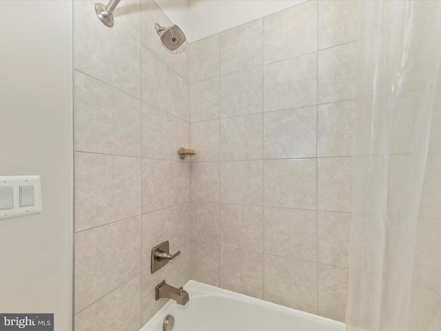 bathroom featuring shower / bathtub combination with curtain