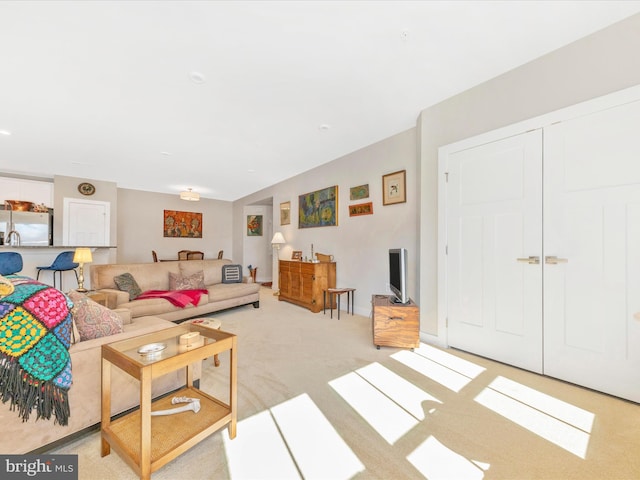 living room featuring light carpet