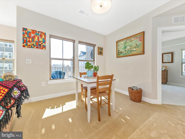 dining area with visible vents, baseboards, and carpet floors