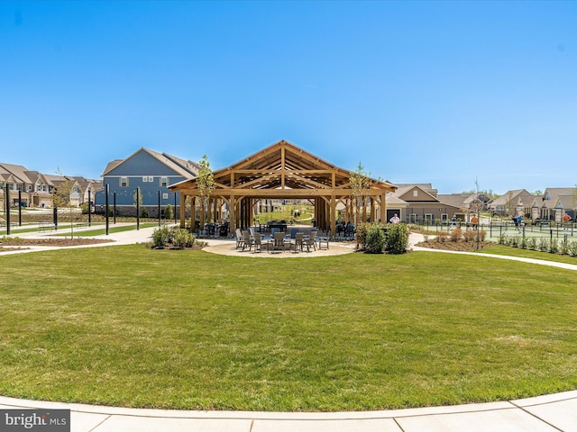 view of home's community featuring a gazebo, a residential view, a patio area, and a yard