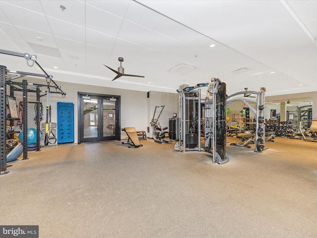 workout area featuring recessed lighting, french doors, and a paneled ceiling