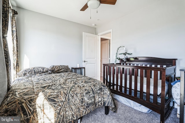 carpeted bedroom featuring ceiling fan