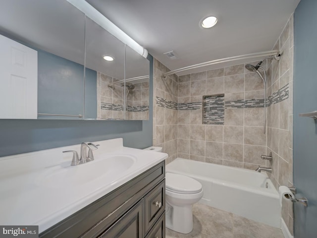 full bathroom featuring tile patterned flooring, toilet, visible vents, vanity, and shower / washtub combination