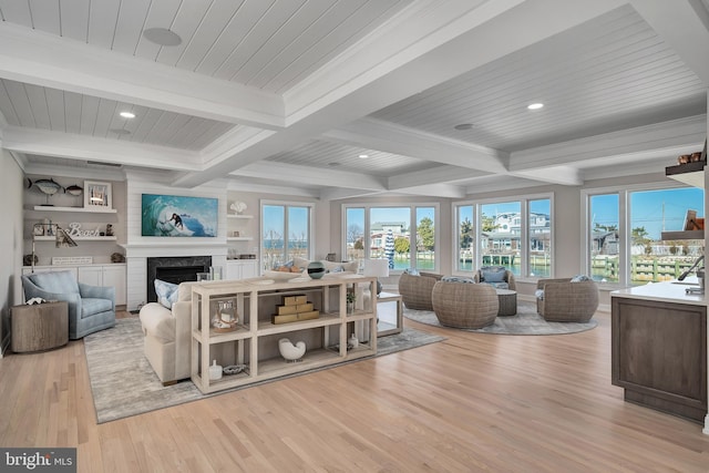 living room with wooden ceiling, wood finished floors, a fireplace, beam ceiling, and recessed lighting