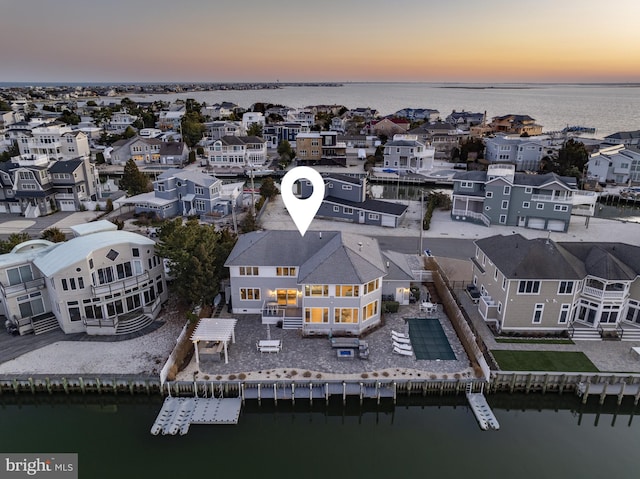 aerial view with a water view and a residential view