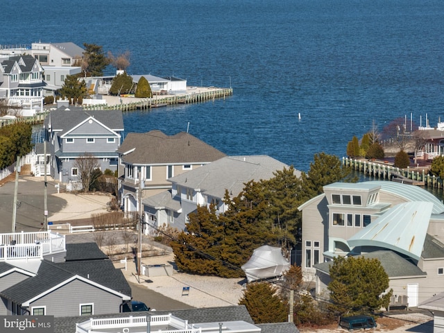 bird's eye view with a residential view and a water view