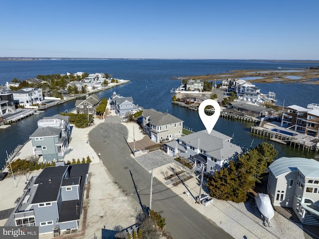 bird's eye view featuring a water view and a residential view