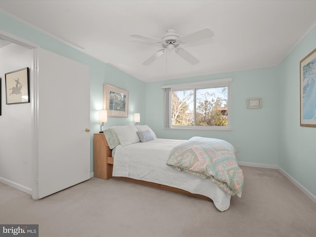 bedroom with carpet floors, a ceiling fan, and baseboards