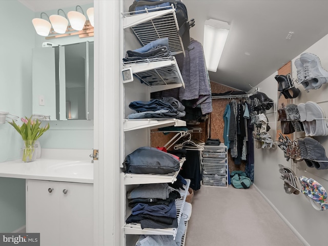 spacious closet featuring a sink