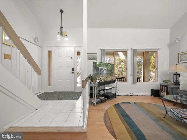 foyer featuring lofted ceiling and wood finished floors