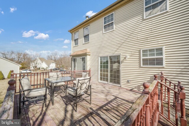 wooden deck featuring outdoor dining space