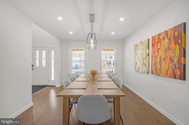 dining space featuring recessed lighting, wood finished floors, and baseboards