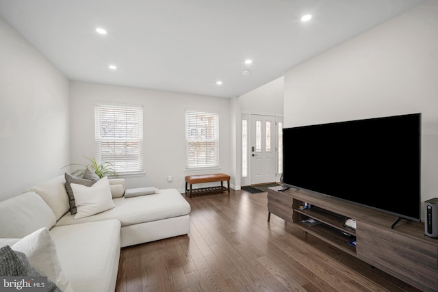 living room featuring recessed lighting and dark wood finished floors