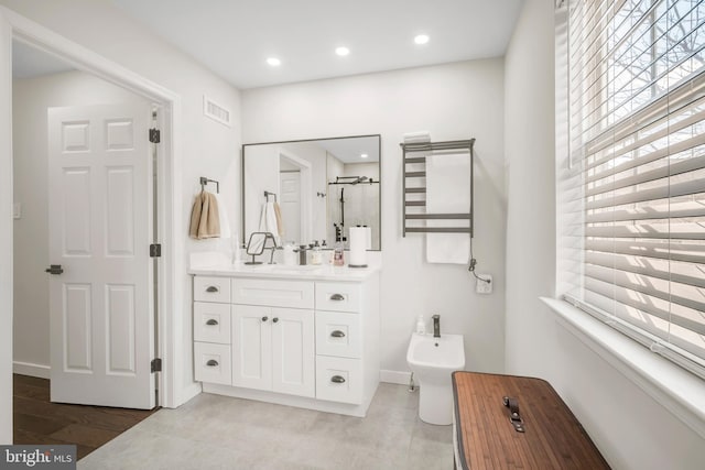 full bath featuring recessed lighting, visible vents, a stall shower, a bidet, and vanity