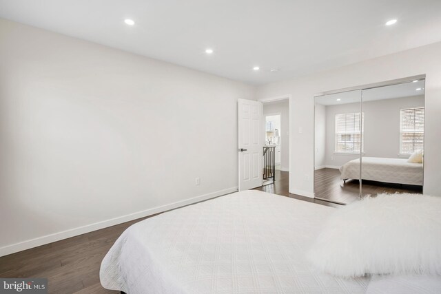 bedroom featuring recessed lighting, baseboards, and wood finished floors