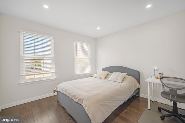 bedroom featuring recessed lighting, wood finished floors, and baseboards