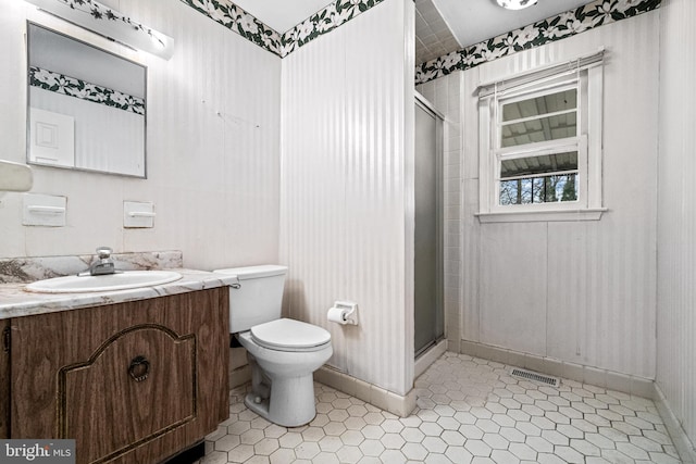 full bathroom with toilet, a shower stall, visible vents, and vanity