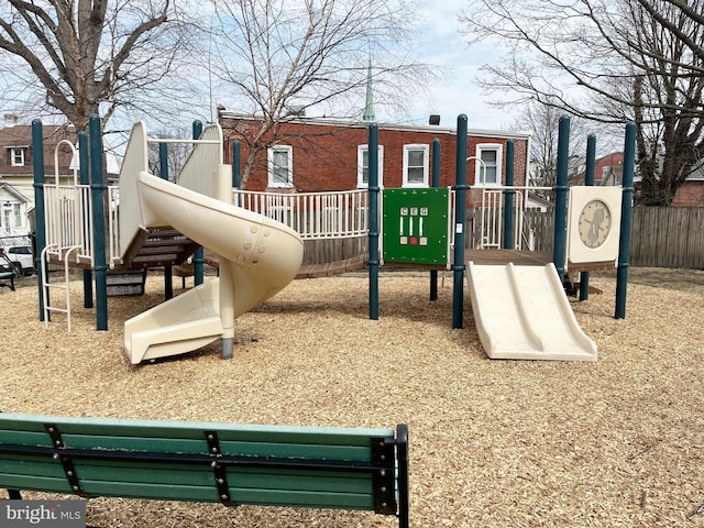 communal playground featuring fence