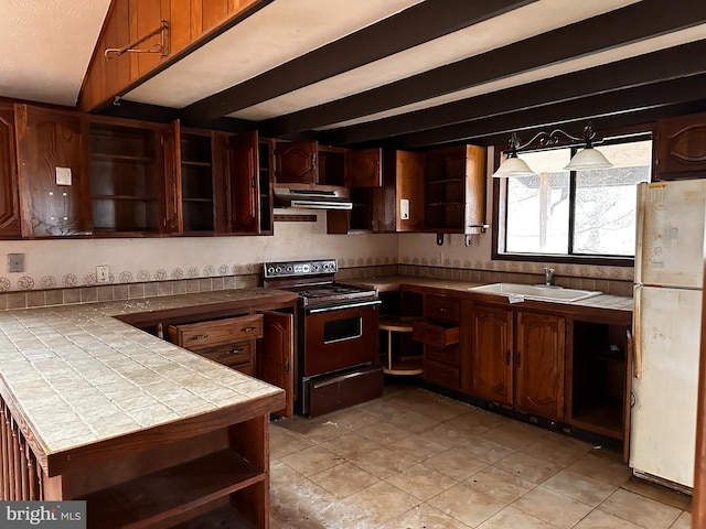 kitchen with electric range oven, freestanding refrigerator, extractor fan, open shelves, and a sink