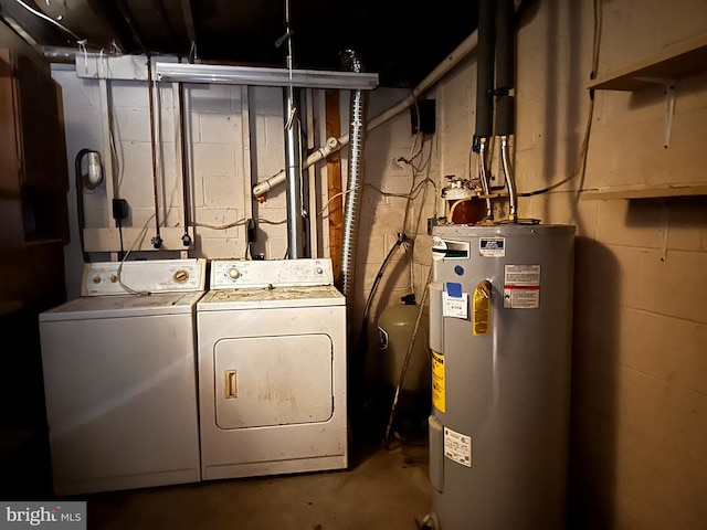 laundry area featuring water heater, laundry area, and independent washer and dryer