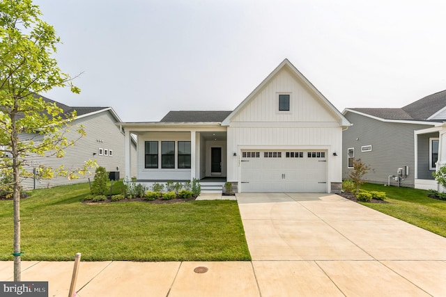 modern farmhouse with board and batten siding, central AC, driveway, and a front lawn