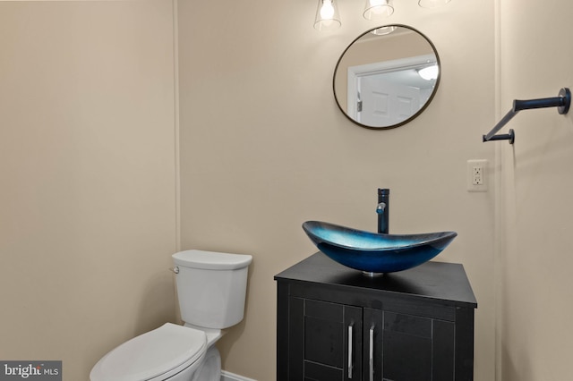 bathroom with toilet and vanity