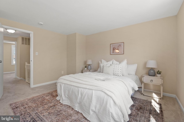 bedroom featuring visible vents, baseboards, and carpet floors