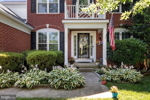 entrance to property with brick siding