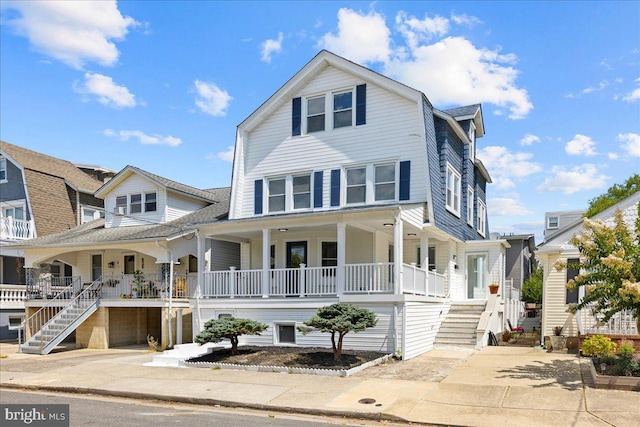 view of front of house with a porch and stairway