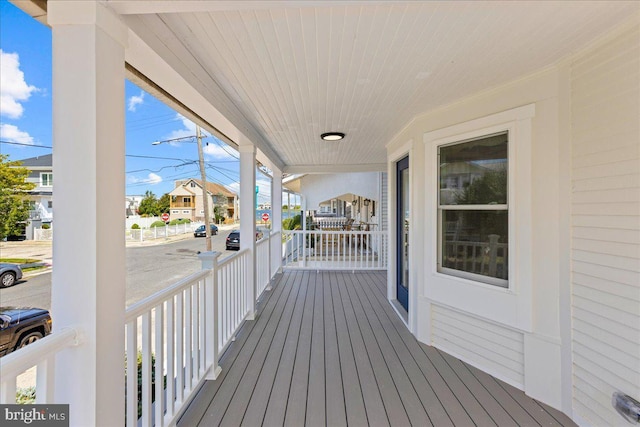 wooden terrace featuring a porch