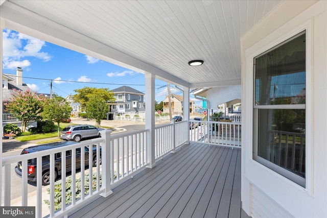 wooden terrace with a residential view