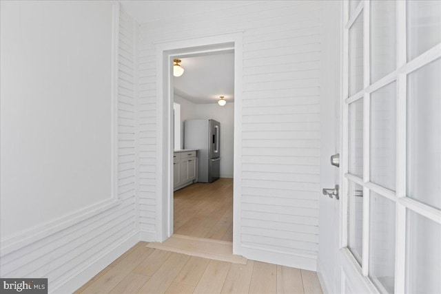 hallway with light wood-type flooring